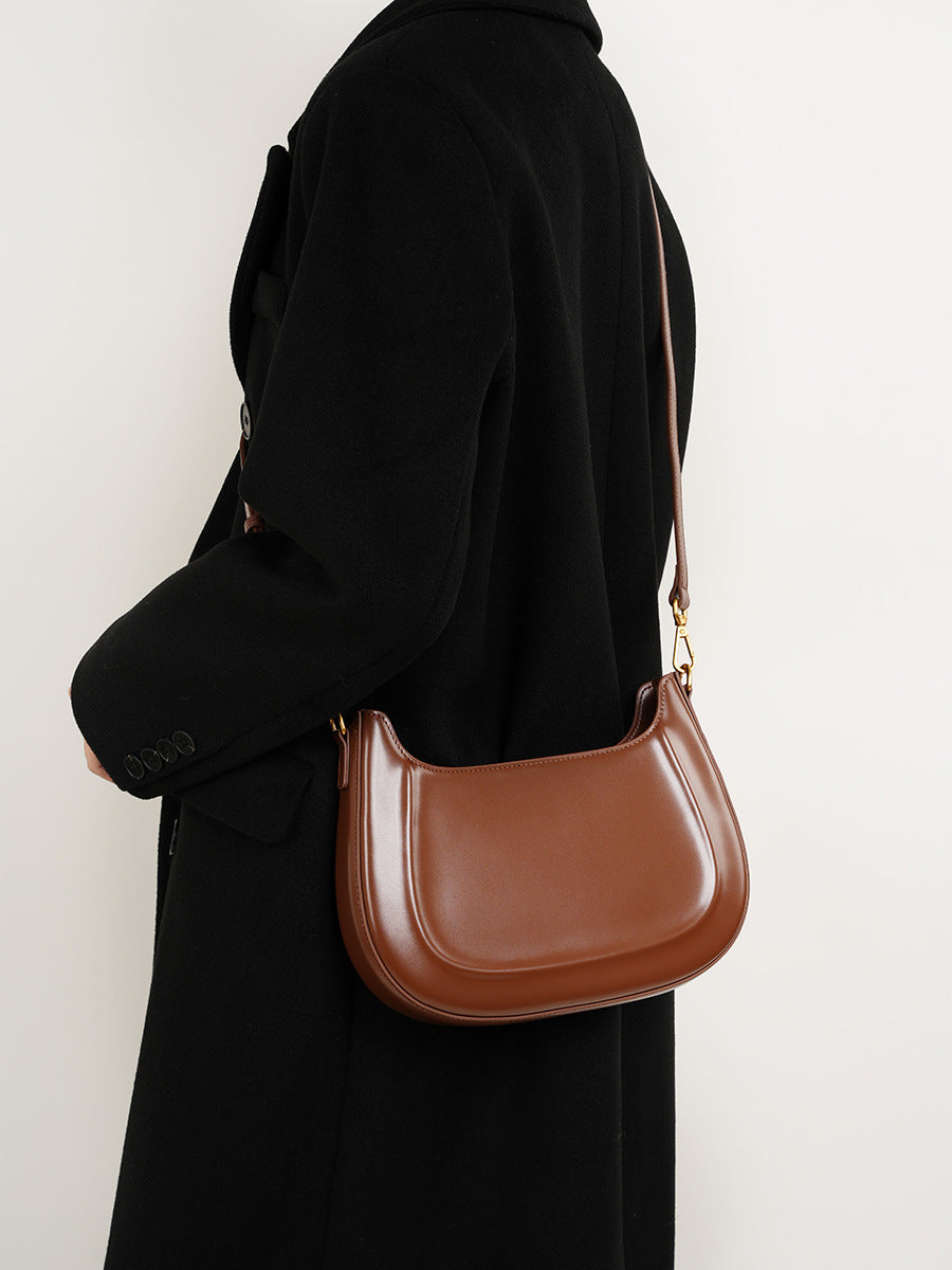 Velvet Season – Glossy Leather Saddle Bag for Elegant Days