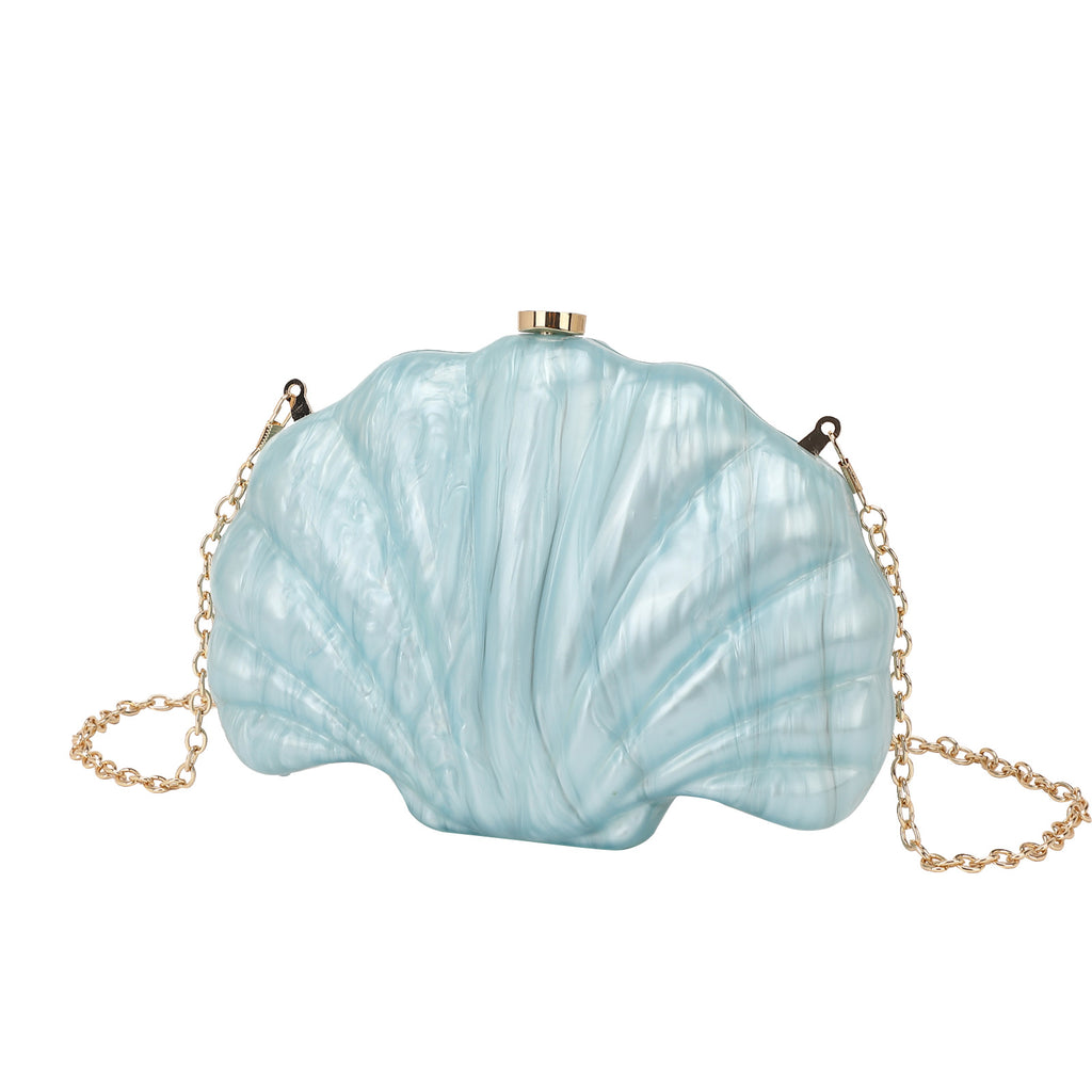 Shelloncé – Acrylic Shell Clutch with Pearl Handle