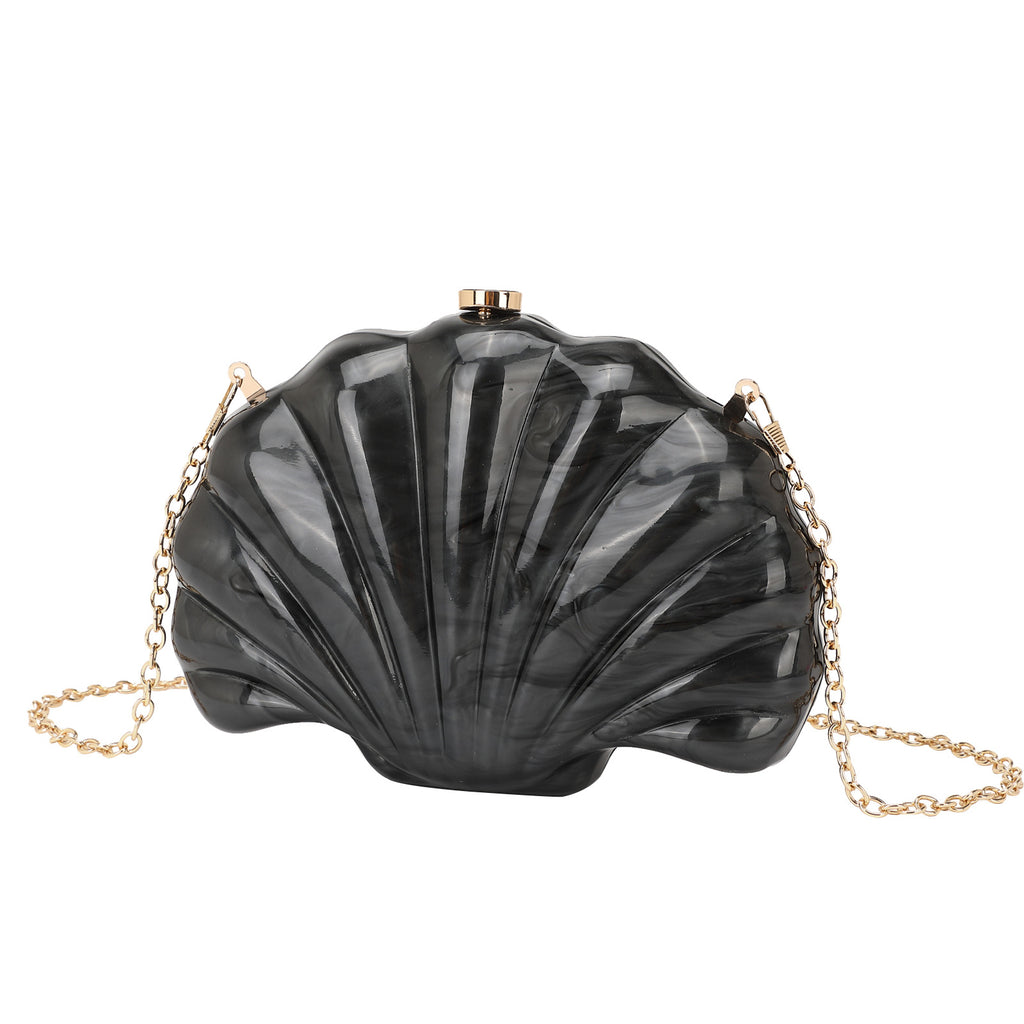 Shelloncé – Acrylic Shell Clutch with Pearl Handle