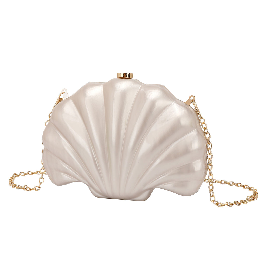 Shelloncé – Acrylic Shell Clutch with Pearl Handle