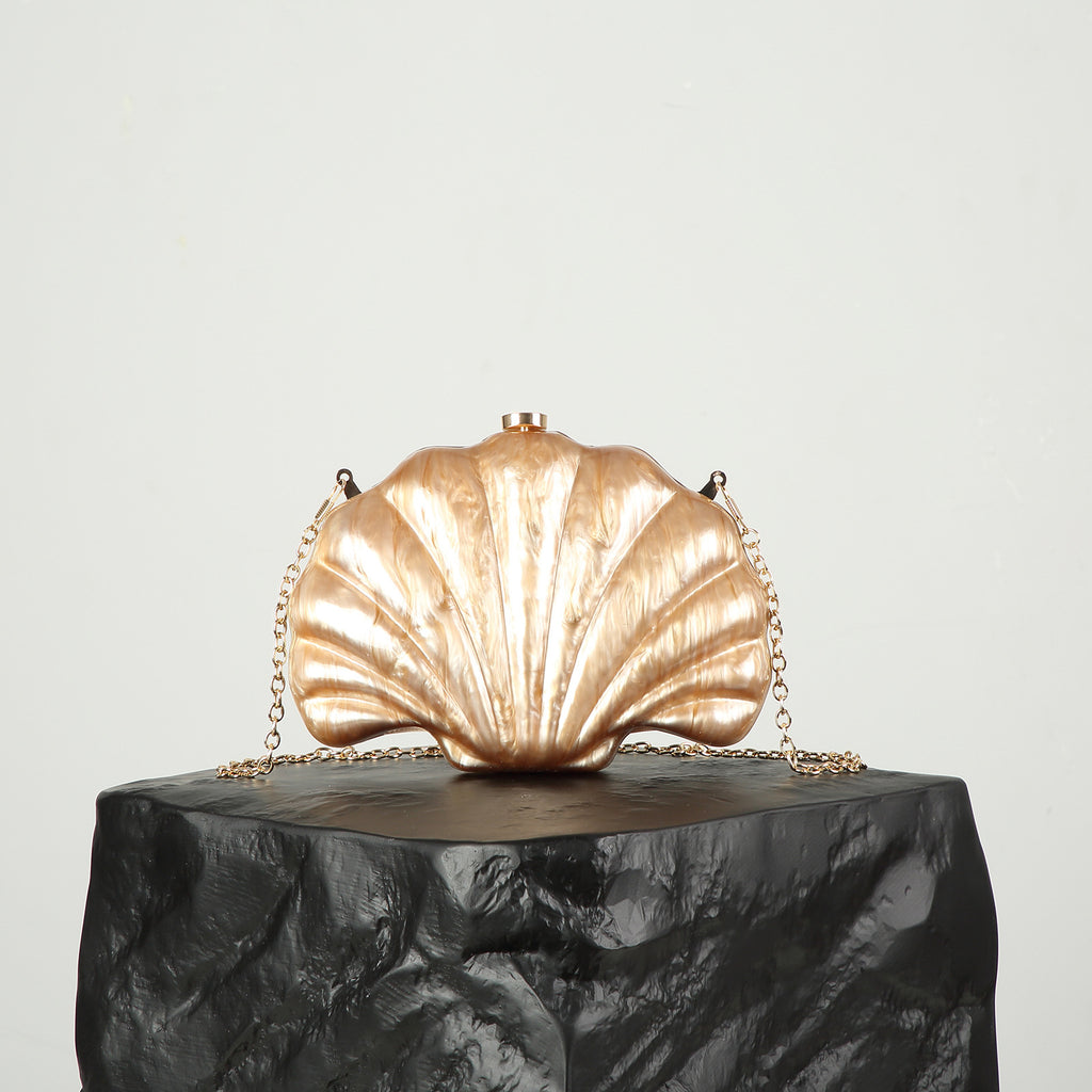 Shelloncé – Acrylic Shell Clutch with Pearl Handle