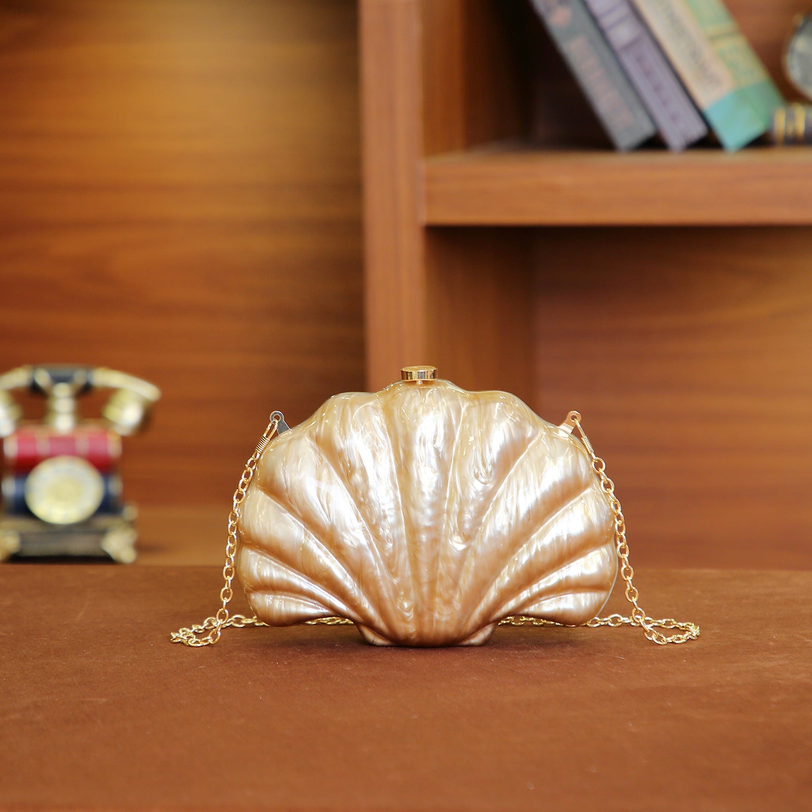 Shelloncé – Acrylic Shell Clutch with Pearl Handle