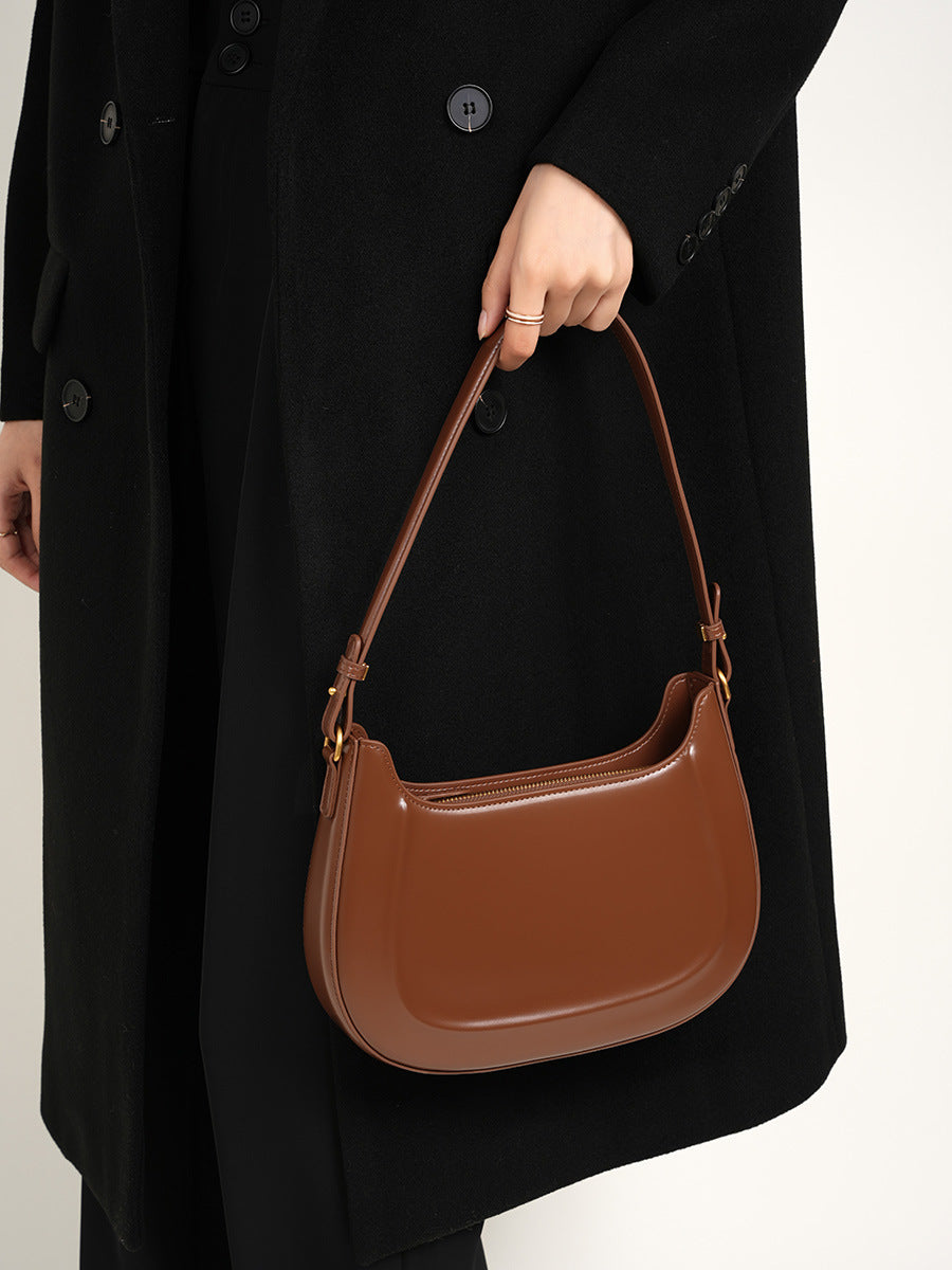 Velvet Season – Glossy Leather Saddle Bag for Elegant Days