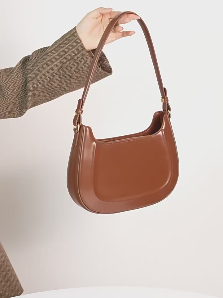 Velvet Season – Glossy Leather Saddle Bag for Elegant Days